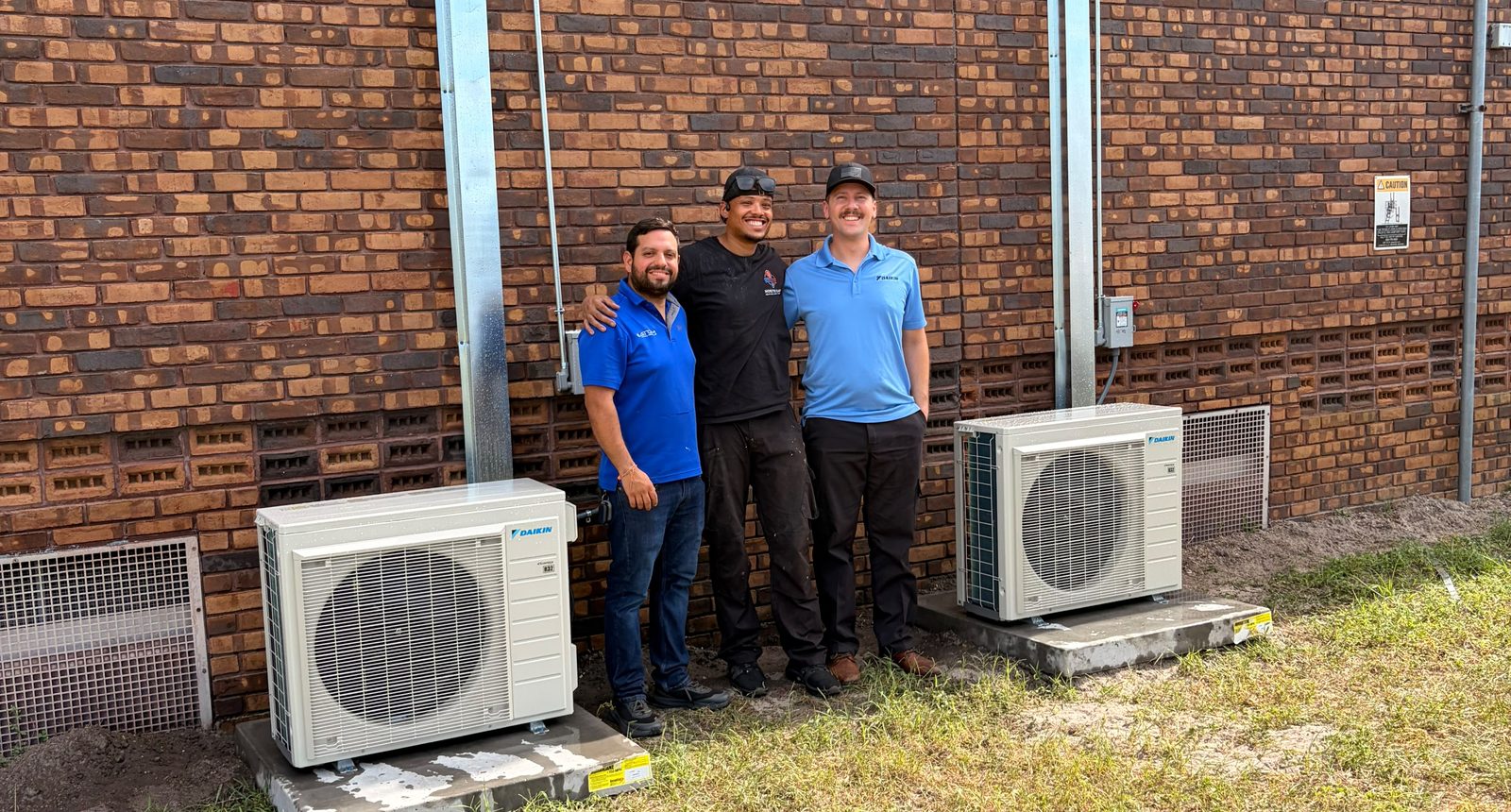 North East Heating And Cooling with the Daikin and Atom crews and two new Daikin condensers at Powell Middle School